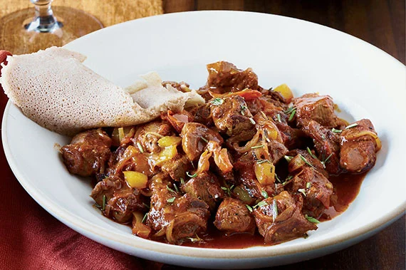 Authentic Ethiopian wot stew served on injera at Enat Restaurant in London, Ontario