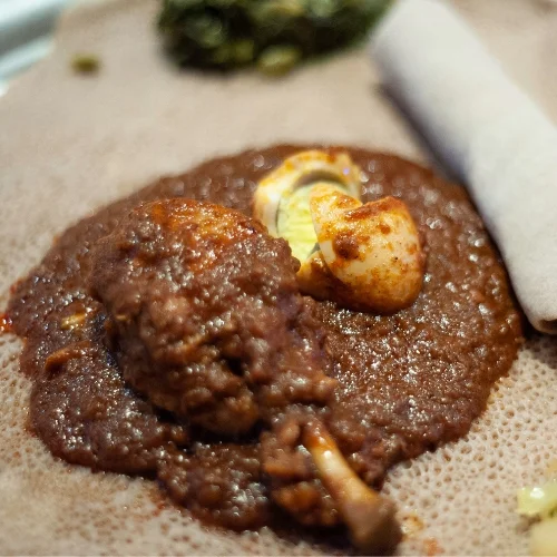 Traditional Ethiopian cuisine with berbere-spiced wots at Enat Restaurant London, Ontario
