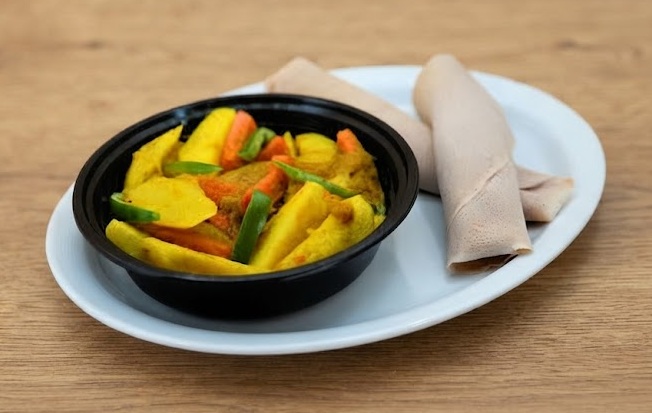 Ethiopian mushroom tibbs and vegetable dishes at Enat Restaurant London, Ontario